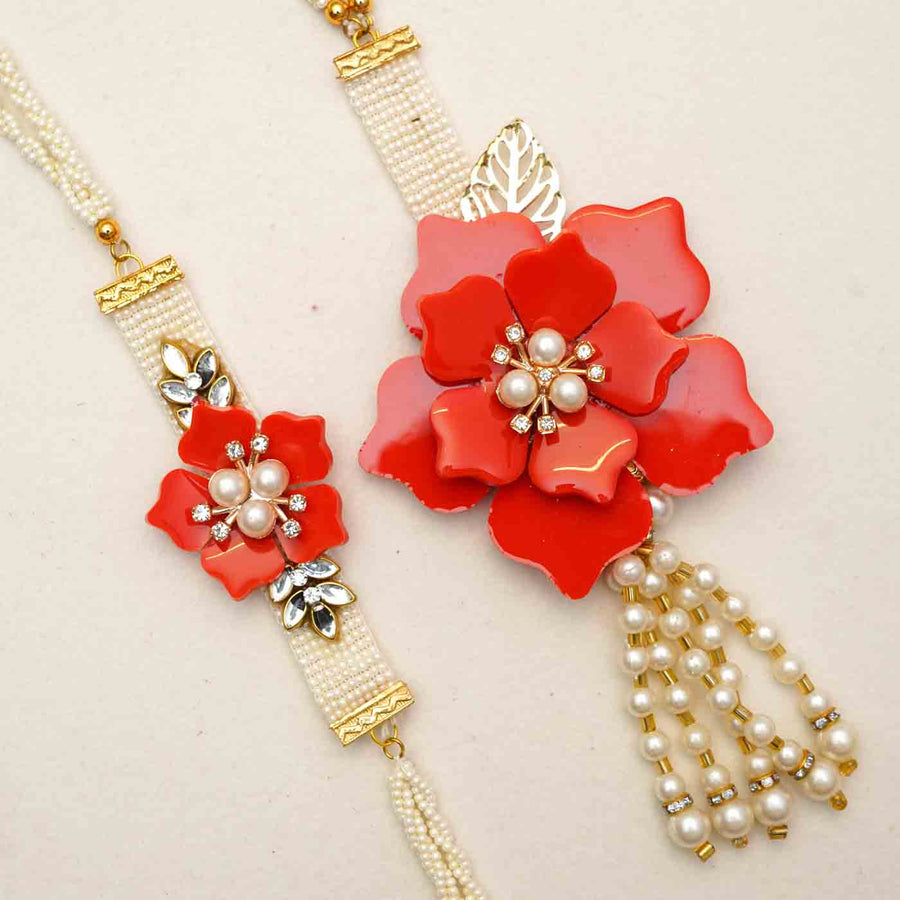 Handmade Red Flower Theme Resin Bhaiya Bhabhi Rakhi With Chocolates And Roli Chawal For Bhaiya And Bhabhi Set Of 2 - Close-up of Rakhi Pair