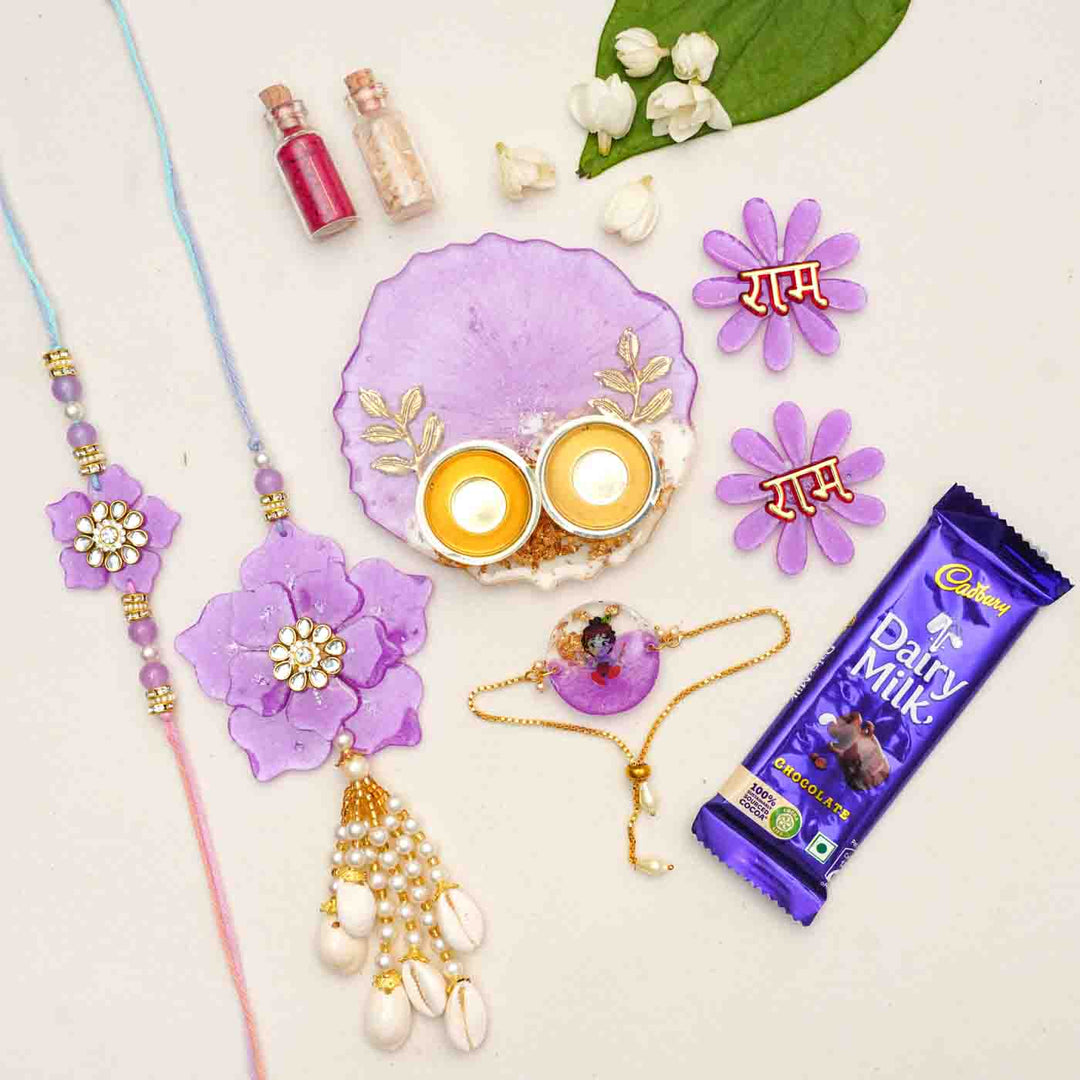 Handmade Purple Floral Theme Resin Rakhi Hamper With Chocolates And Roli Chawal For Bhaiya Bhabhi And Kids Set Of 6 - Flat Lay with Additional Items