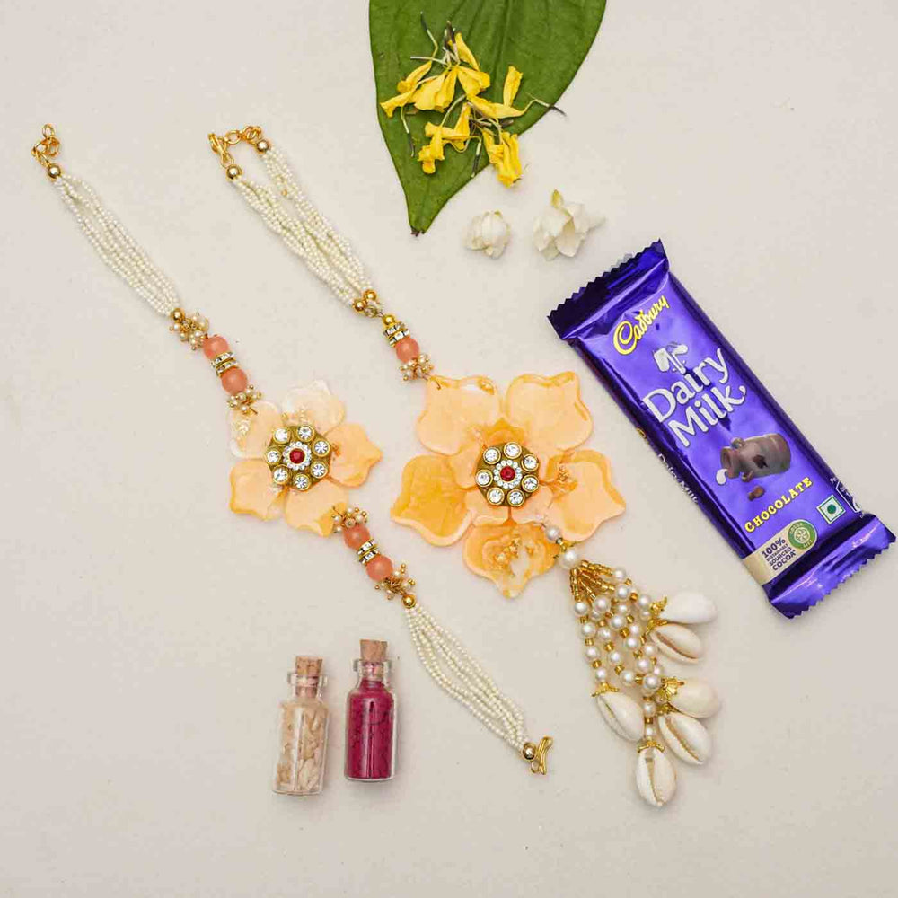 Handmade Yellow Flower Theme Resin Bhaiya Bhabhi Rakhi With Chocolates And Roli Chawal For Bhaiya And Bhabhi Set Of 2 - Rakhi Pair with Gift Items