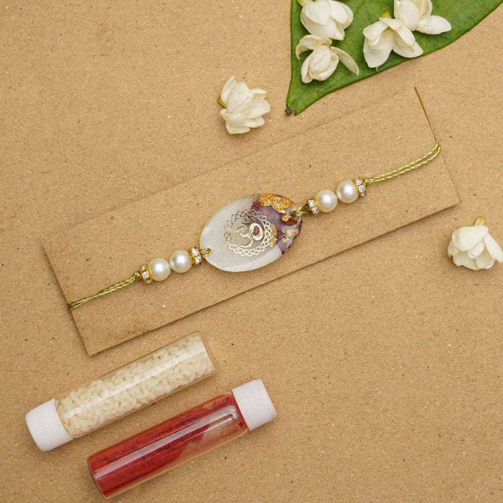 Handmade Resin Om Presserved Flower Rakhi With Roli Chawal - Bracelet with Packaging Contents