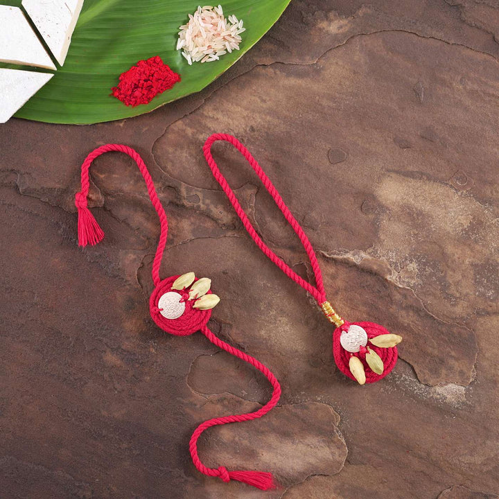 Handmade Elaichi Cotton Bhaiya Bhabhi Rakhi With Roli Chawal Set Of 2 - Flat Lay with Decorative Elements
