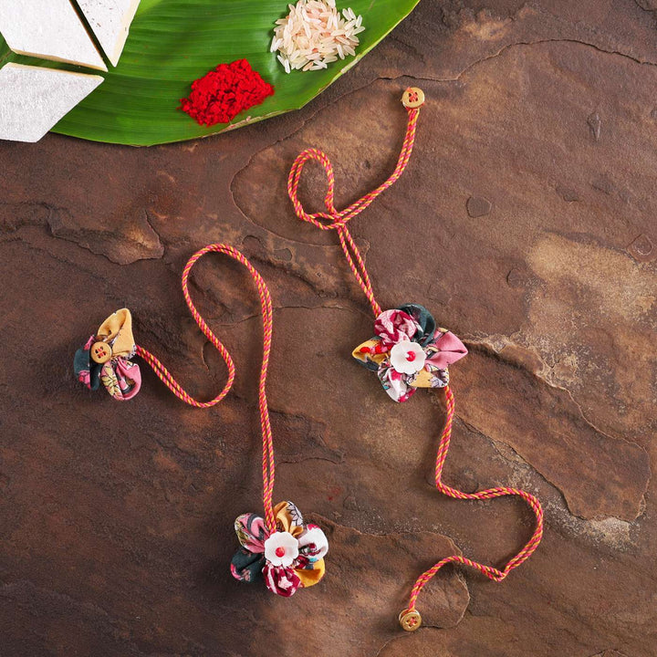 Handmade Fabric Flower Bhaiya Bhabhi Rakhi With Roli Chawal Set Of 2 - Full View with Decorative Elements
