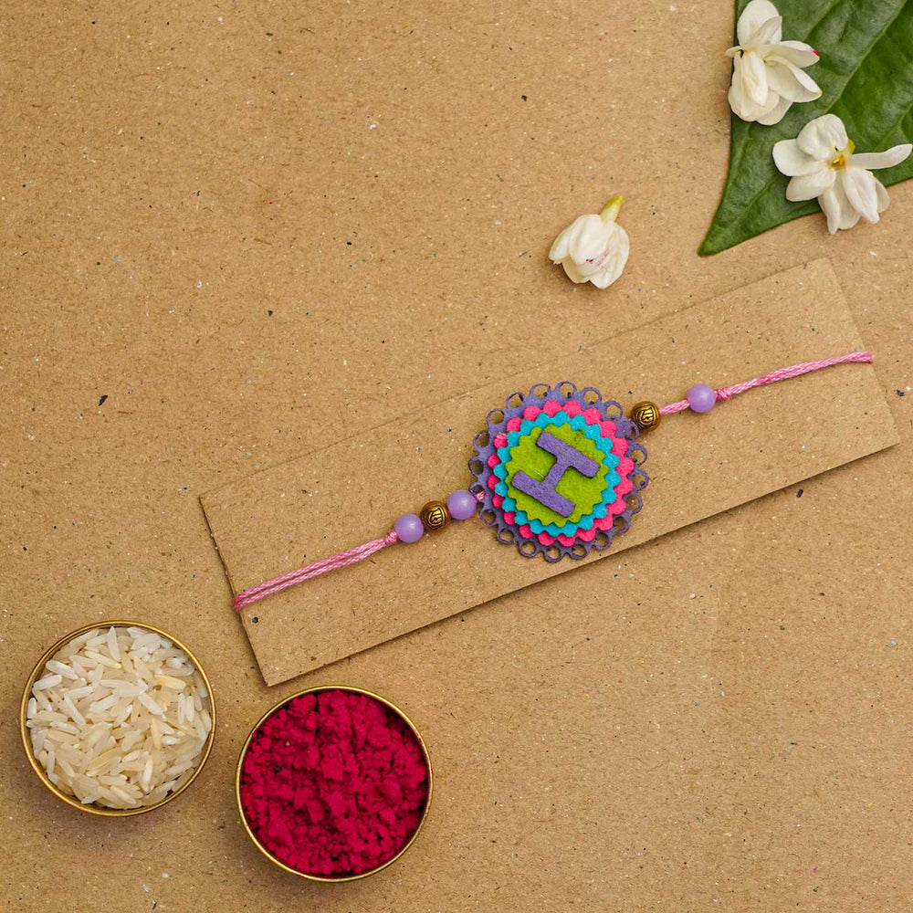 Personalized Handmade Felt Rakhi With Roli Chawal - Flat Lay with Accessories