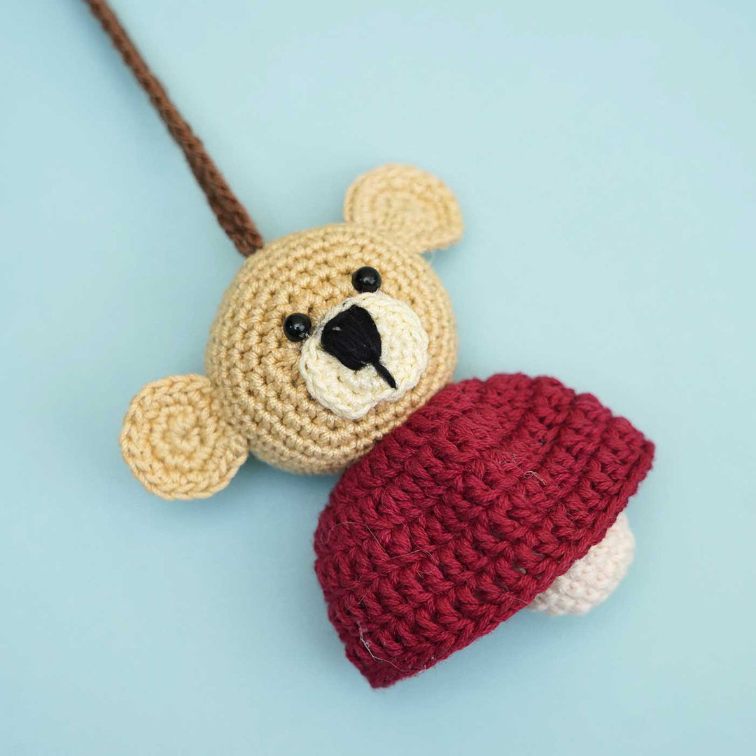 Handmade Crochet Teddy Hug Kids Rakhi With Roli Chawal - Packaged Front View of Bears with Caps