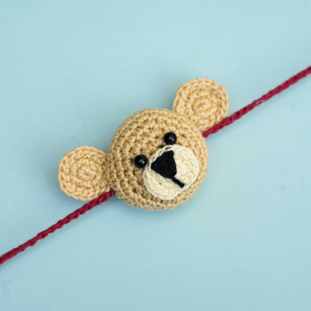 Handmade Crochet Teddy Hug Kids Rakhi With Roli Chawal - Close-up Front View