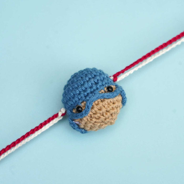 Handmade Crochet Captain America Kids Rakhi With Roli Chawal - Close-up of Crocheted Detail