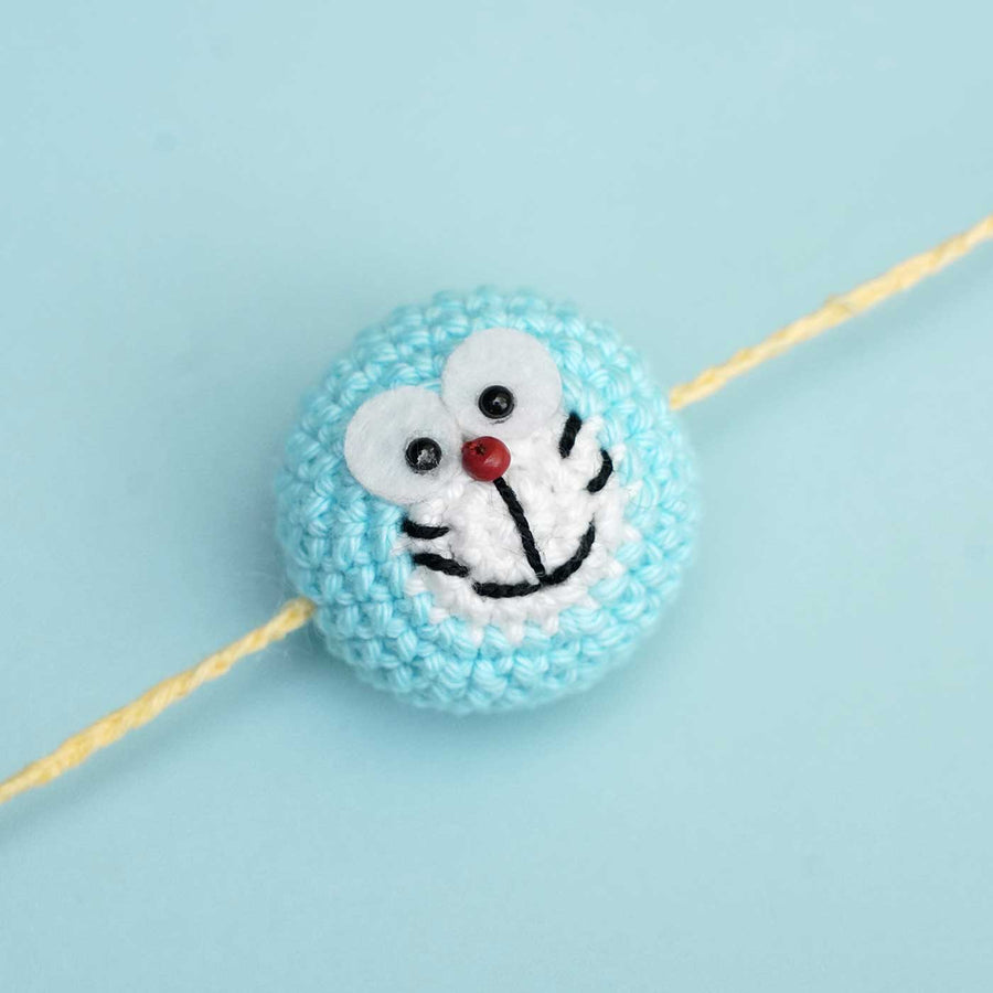 Handmade Crochet Doraemon Kids Rakhi With Roli Chawal - Close-up of Crochet Charm