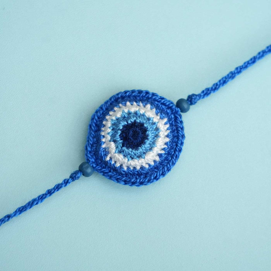 Handmade Crochet Evil Eye Kids Rakhi With Roli Chawal - Close-up Front View