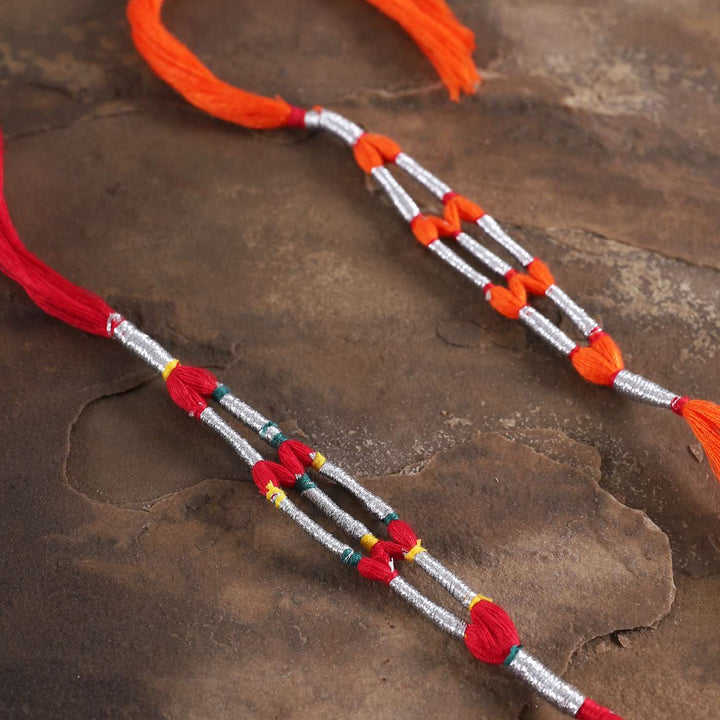 Handmade Beaded Jaali Zari Rakhi With Roli Chawal Set Of 2 - Close-up of decorative knots