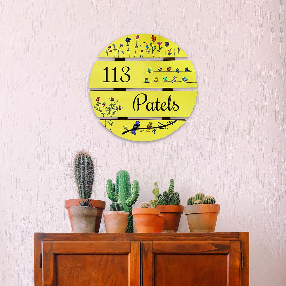 Handcrafted Personalized Floral Round Pinewood Name Plate - Mounted on Wall Above Furniture