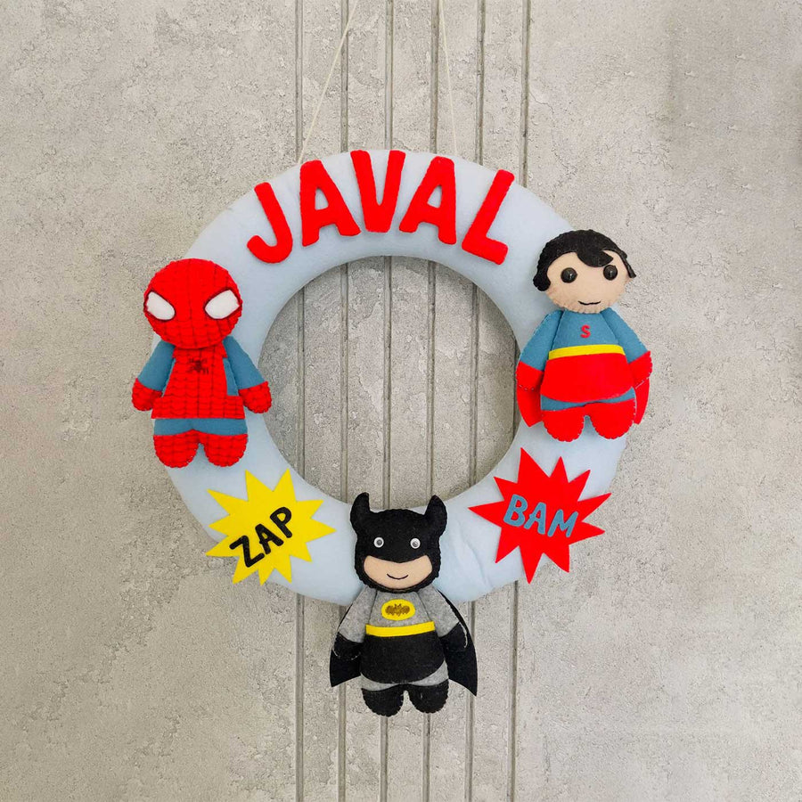Handmade Personalized Mini Superhero Themed Felt Kids Name Hanging - Front View Hanging on Wall