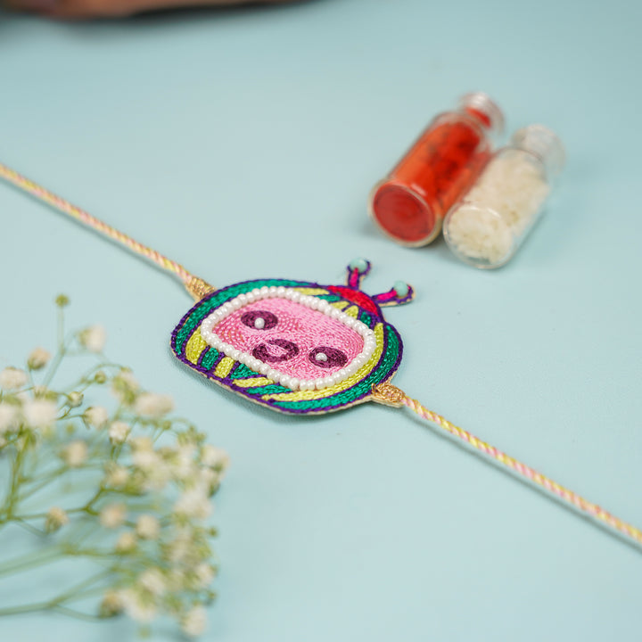 Handmade Beaded Cocomelon Theme Kids Rakhi With Roli Chawal - Top View Showing Full Bracelet