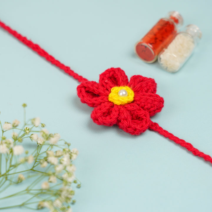 Customized Handmade Crochet Rubi Petal Floral Bhaiya Bhabhi Rakhi With Roli Chawal - Single flower wristband close-up