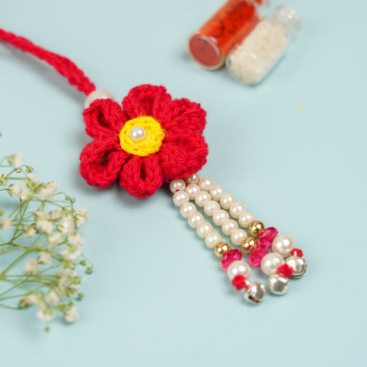 Customized Handmade Crochet Rubi Petal Floral Bhaiya Bhabhi Rakhi With Roli Chawal - Close-up of blue flower with beads