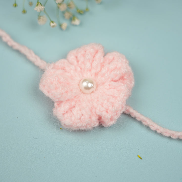 Customized Handmade Crochet Floral Rakhi With Roli Chawal For Brother - Close-up of Pink Rakhi Flower