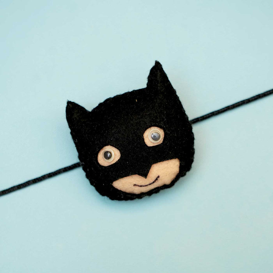 Handmade Batman Felt Rakhi With Roli Chawal - Close-up of Face Detail