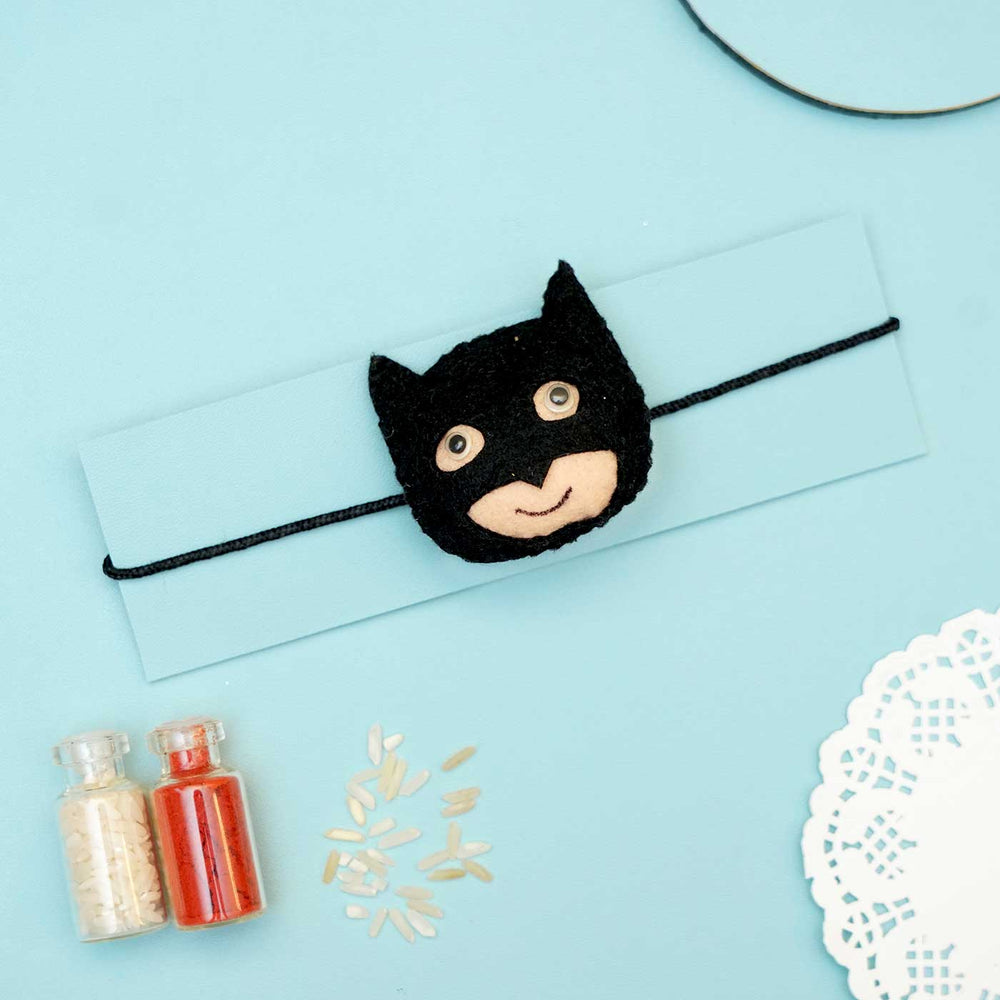 Handmade Batman Felt Rakhi With Roli Chawal - Bracelet Displayed on Card