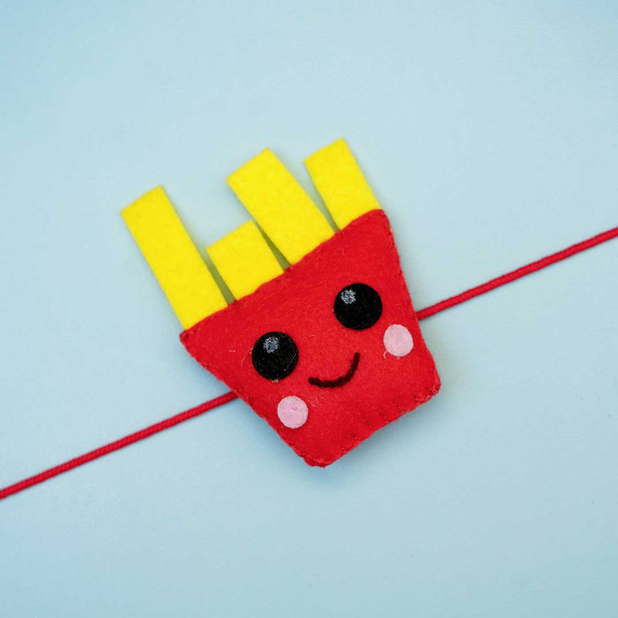 Handmade French Fries Felt Rakhi With Roli Chawal - Close-up of French Fries Rakhi