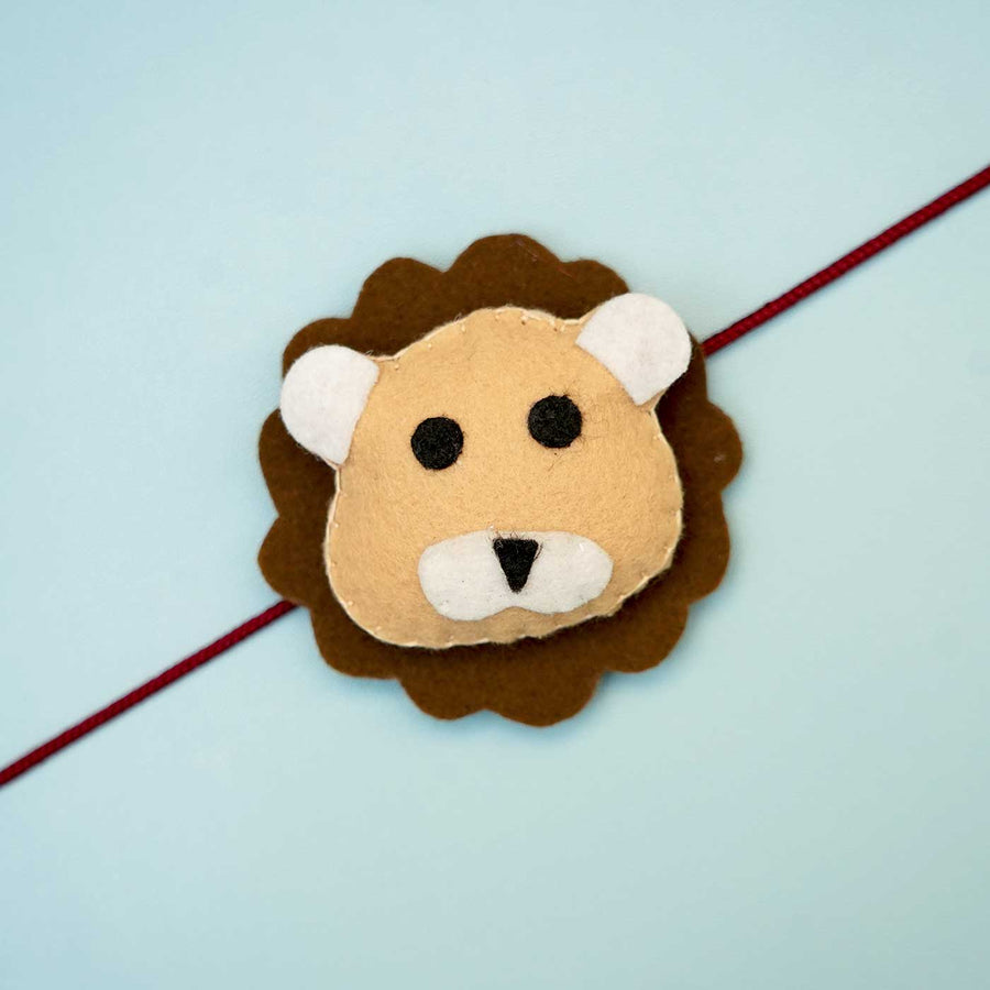 Handmade Lion Felt Rakhi With Roli Chawal - Close-up of Lion Rakhi