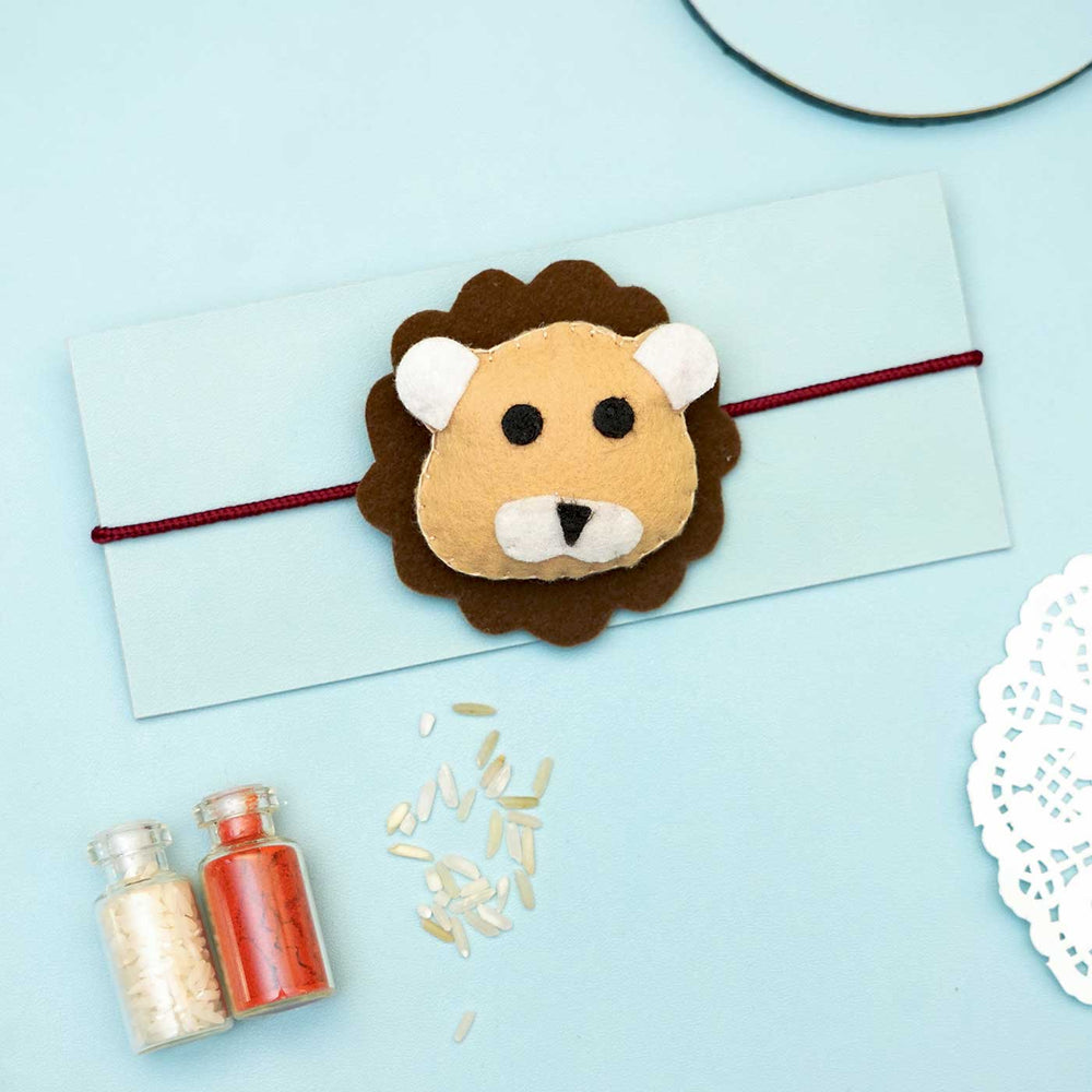 Handmade Lion Felt Rakhi With Roli Chawal - Lion Rakhi on Envelope
