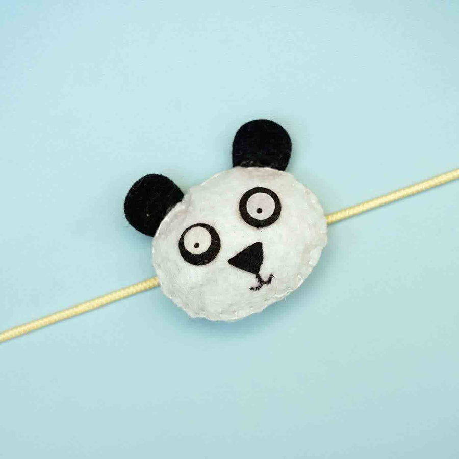 Handmade Panda Felt Rakhi With Roli Chawal - Close-up of Panda Rakhi