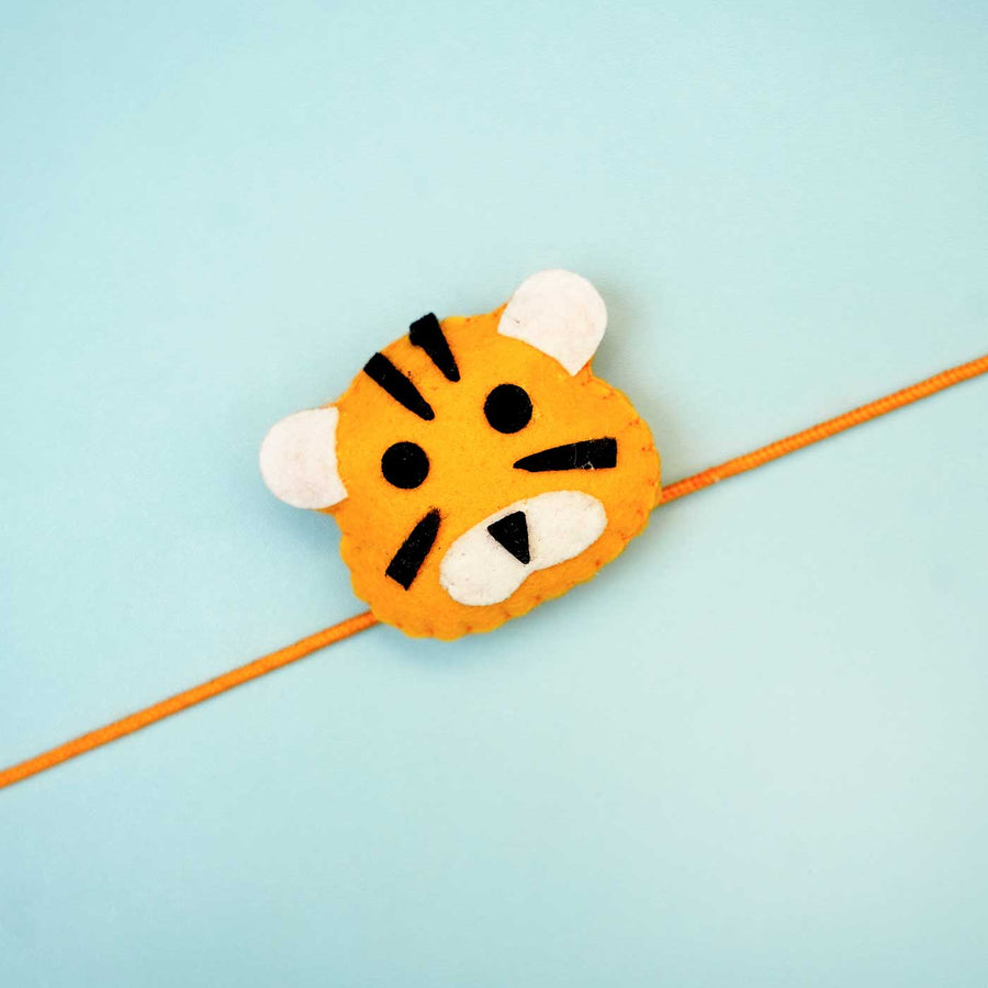 Handmade Tiger Felt Kids Rakhi With Roli Chawal - Close-up of Tiger Rakhi
