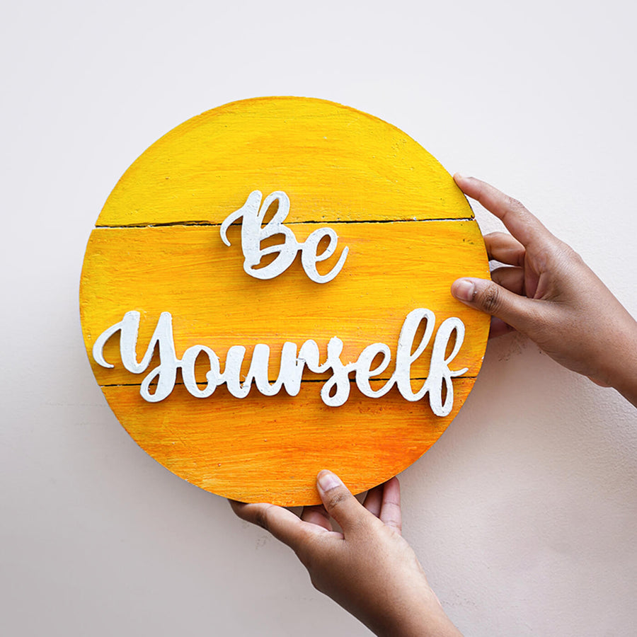 Hand Painted Personalized Round Wooden Name Plate - Front View with Hands Holding