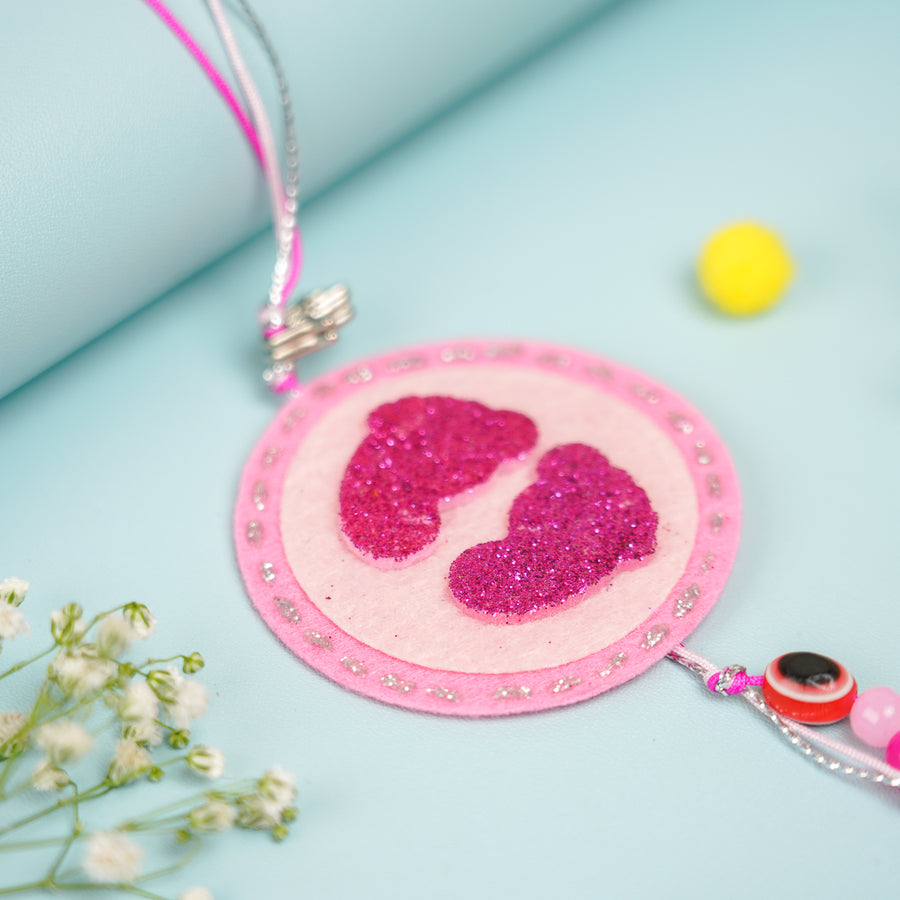 Handmade Baby Feet Theme Felt Kids Rakhi With Roli Chawal - Close-up of Pendant Detail
