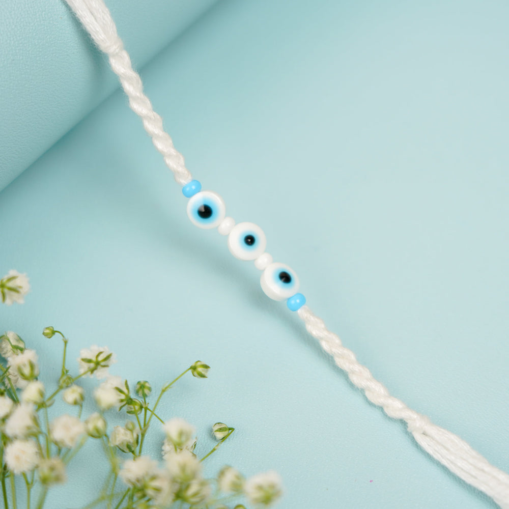 Handmade Evil Eye Bhaiya Bhabhi Rakhi With Roli Chawal Set Of 2 - Close-up of Beads Detail