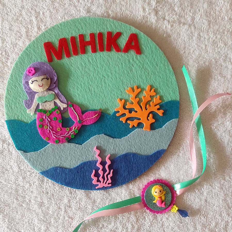 Personalized Handmade Mermaid Theme Felt Kids Rakhi And Name Plate Combo For Sisters Set Of 2 - Front View with Ribbon Bracelet