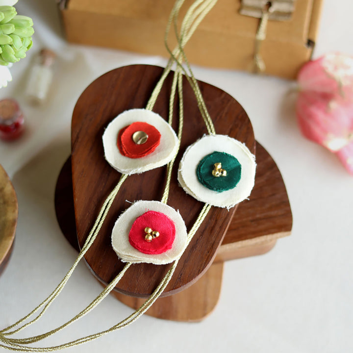 Handmade Reusable Dual Layer Upcycled Fabric Rakhi With Roli Chawal For Brother Set Of 3 - Close-up on Product Details