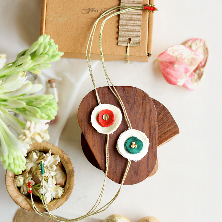 Handmade Reusable Dual Layer Upcycled Fabric Rakhi With Roli Chawal For Brother Set Of 2 - Necklace Front View with Different Colors