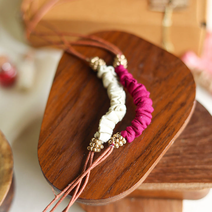 Handmade Reusable Beaded Ruched Upcycled Fabric Rakhi With Roli Chawal For Brother Set Of 2 - Close-up on Bracelet Detail