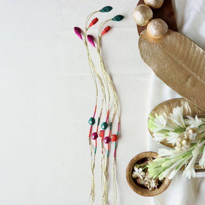 Handmade Reusable Colourful Theard Pods Upcycled Fabric Rakhi With Roli Chawal For Brother - Necklaces Arranged with Decorative Elements
