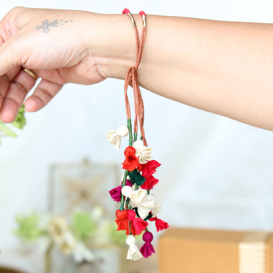 Handmade Reusable Colorful Floral Tassel Latkans Upcycled Fabric Lumba Rakhi For Bhabhi With Roli Chawal - Hand Wearing Product Display