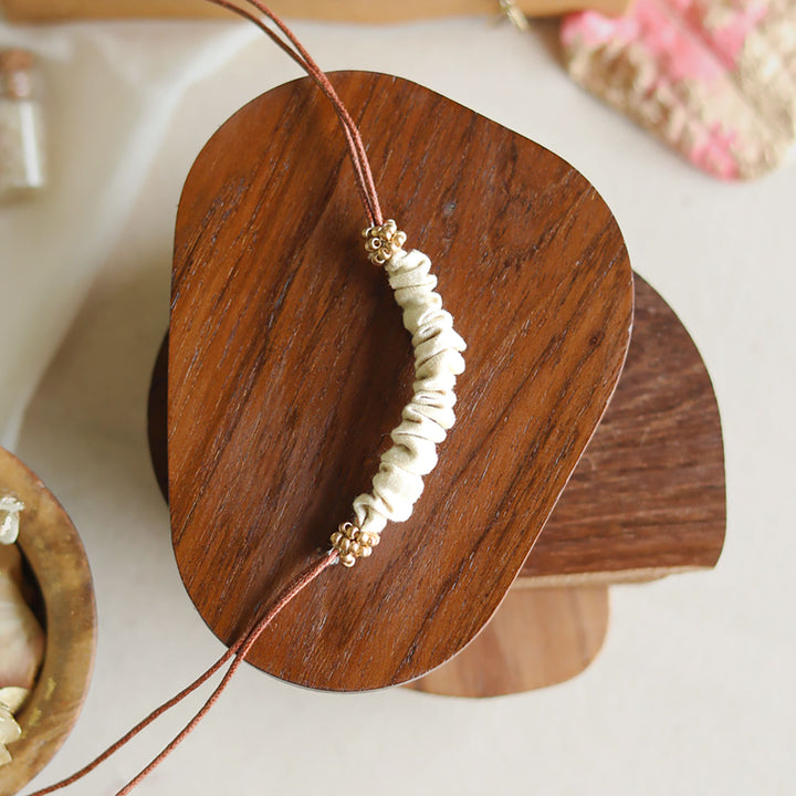 Handmade Reusable Beaded Ruched Upcycled Fabric Rakhi With Roli Chawal For Brother - Front View