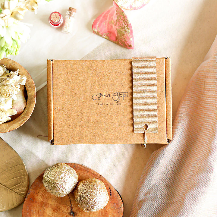 Handmade Reusable Floral And Gold Accent Upcycled Fabric Rakhi With Roli Chawal For Brother - In Packaging with branding