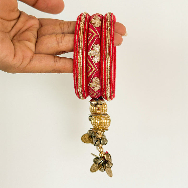 Handmade Beaded Traditional Ghungroo Cotton Bangle Lumba With Roli Chawal For Bhabhi 1 - Side View Held in Hand