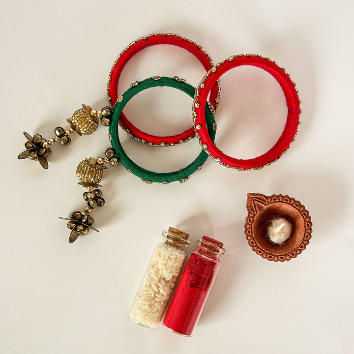 Handmade Beaded Red Green Ghungroo Cotton Bangle Lumba With Roli Chawal For Bhabhi - Front View with Ritual Items