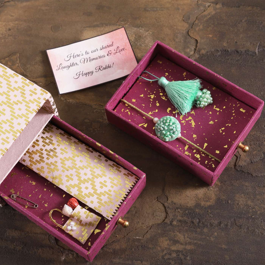 Handmade Moti Tassel Rakhi Hamper With Chocolates And Roli Chawal For Bhaiya And Bhabhi - Opened Box with Contents Displayed