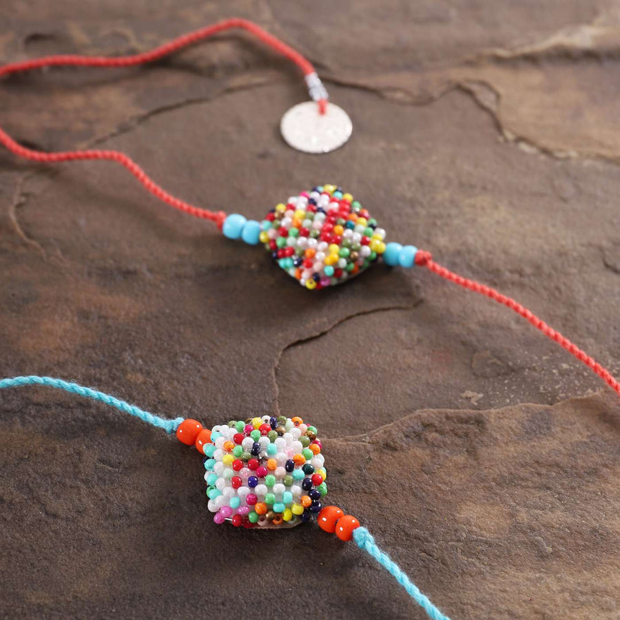 Handmade Beaded Square Rakhi With Roli Chawal Set Of 2 - Close-up of Beaded Centerpiece