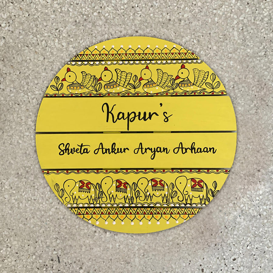 Round Hand Painted Madhubani Art Name Plate 3 - Top-down View on Surface