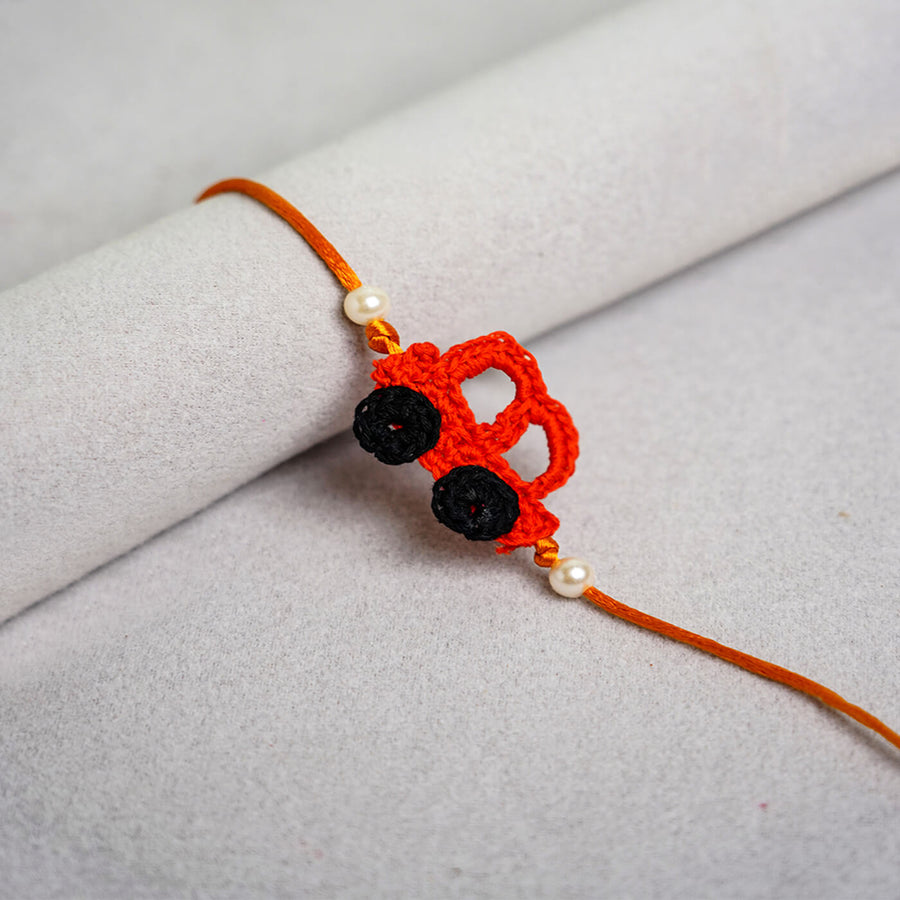 Quirky Handcrafted Crochet Rakhi With Roli Chawal For Kids 2 - Close-up Front View