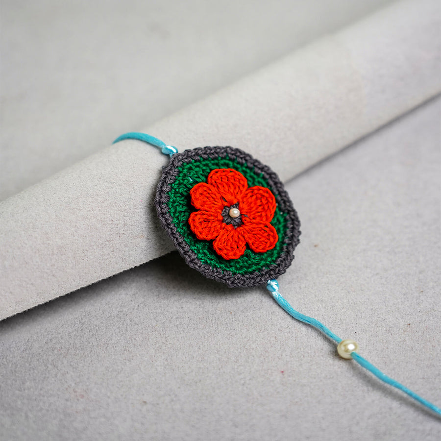 Floral Handcrafted Crochet Rakhi With Roli Chawal For Kids 3 - Close-up Front View