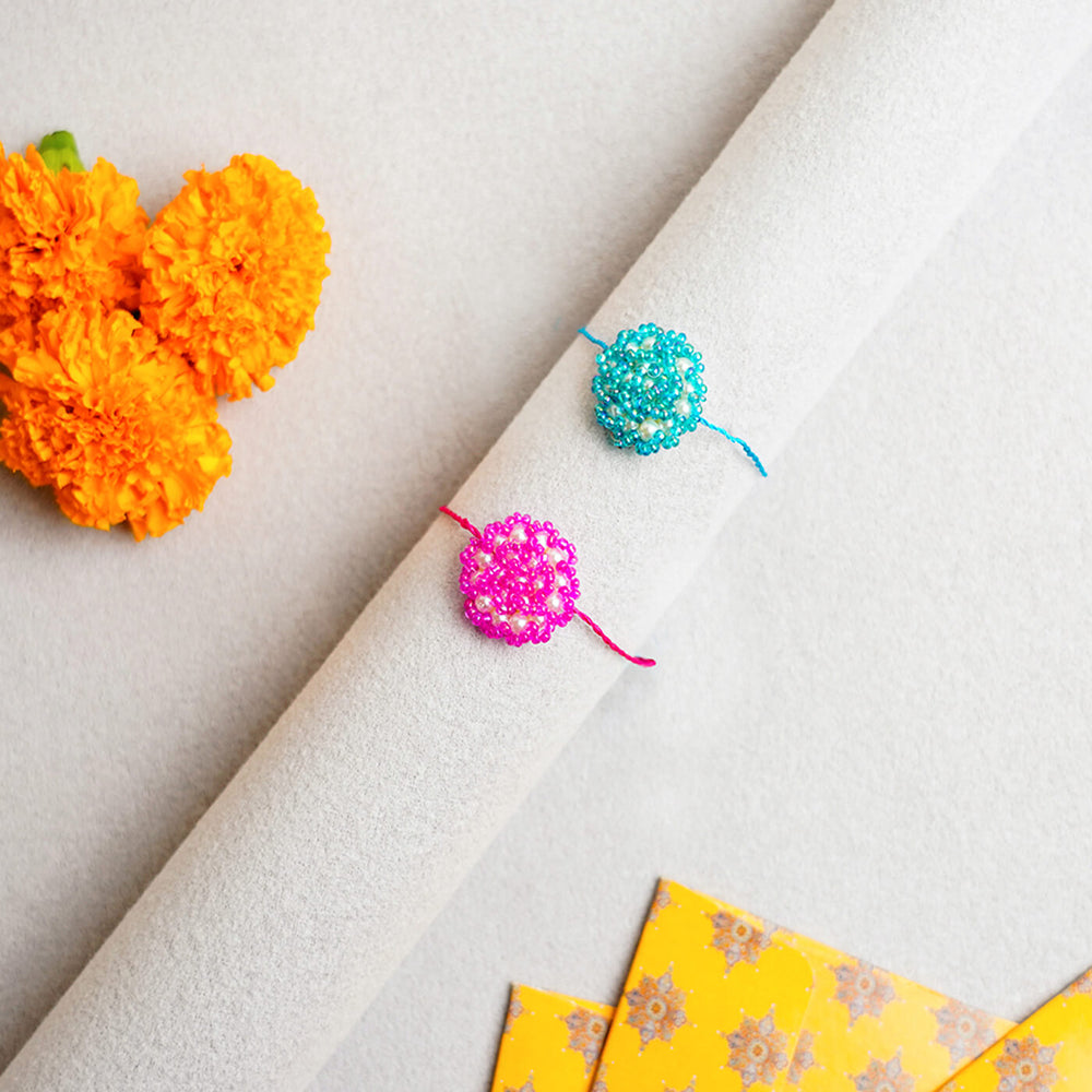 Handcrafted Rose Glass Beads Rakhi Set Of 2 - Rakhis on Display Roll with Decorations