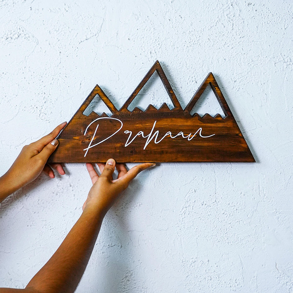 Handpainted Mountain Wooden Kids Name Plate - Name Personalization Example Holding Against Wall