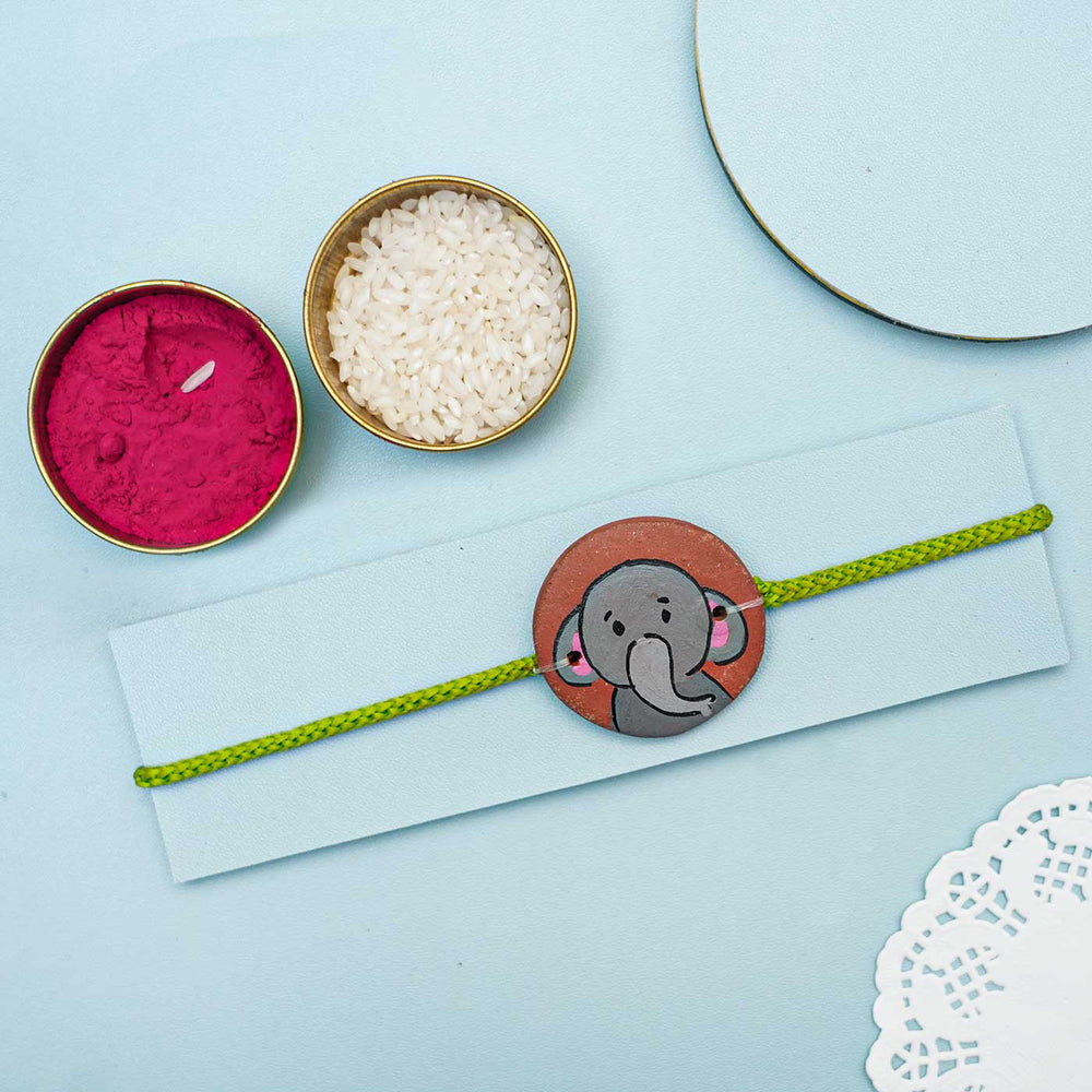 Hand Painted Elephant2 Terracotta Rakhi With Roli Chawal For Kids Copy - Styled with Traditional Pooja Items