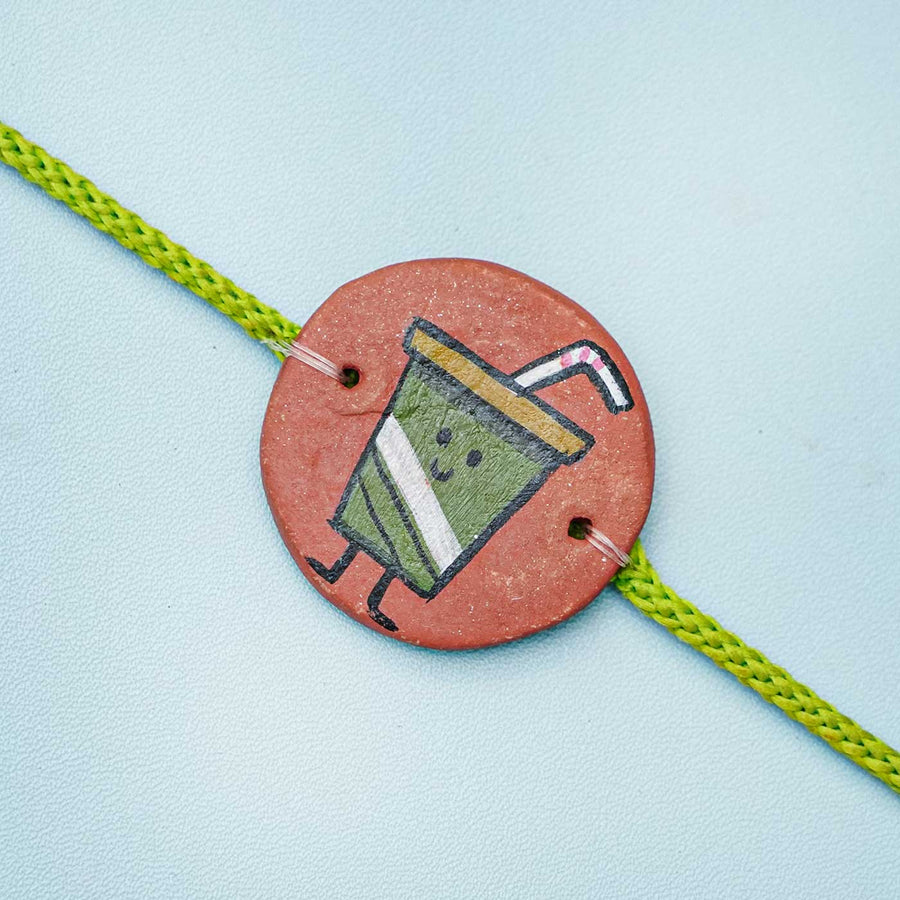 Hand Painted Pizza Terracotta Rakhi With Roli Chawal - Close-up of Bracelet Detail