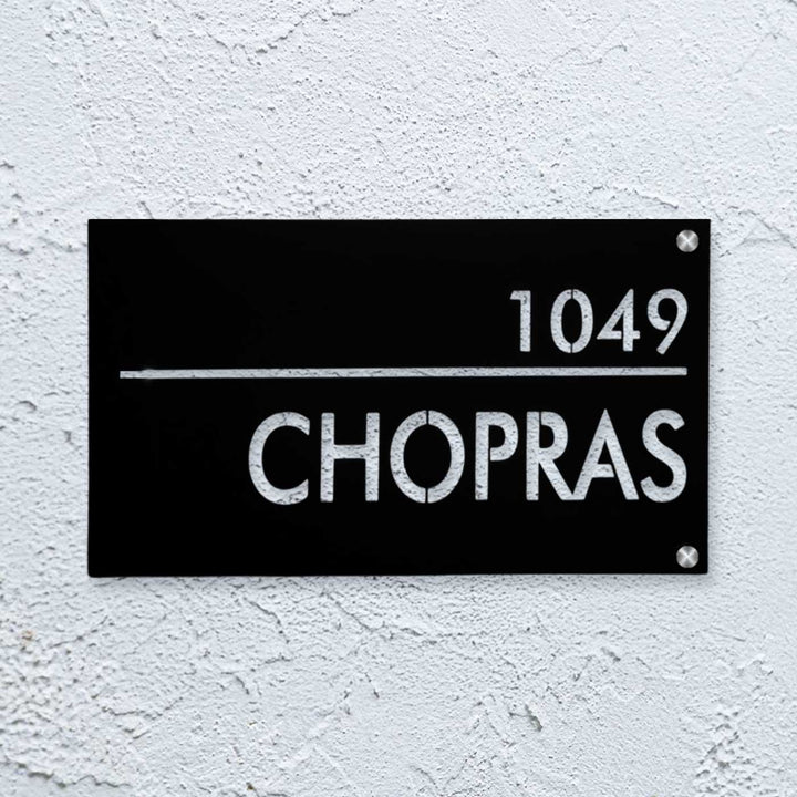 Personalized Waterproof Black Laser Cut Metal Led Name Plate - Mounted on textured wall close-up
