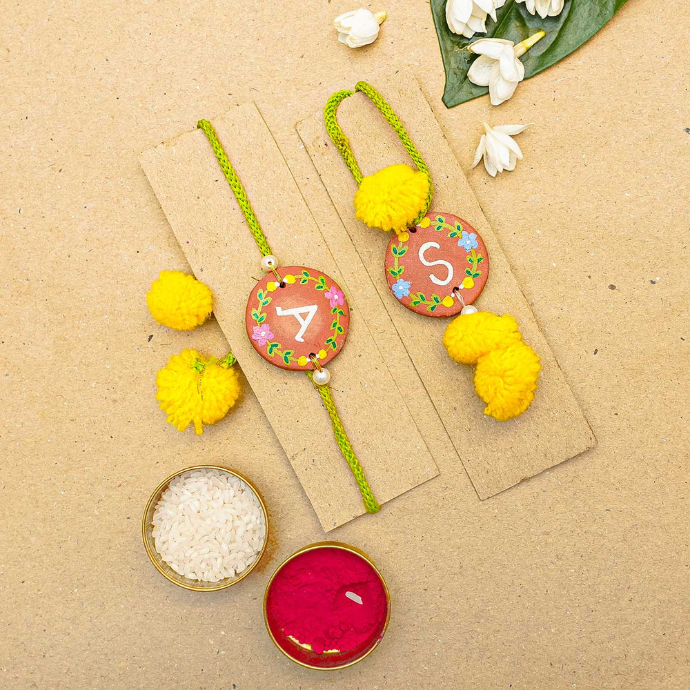 Personalised Handcrafted Bhaiya Bhabhi Initial Terracotta Rakhi With Roli Chawal - Rakhis with traditional accessories